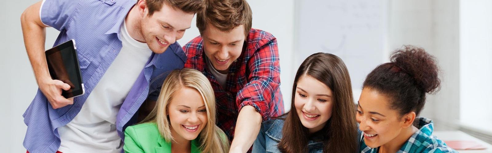 Students looking at computer together