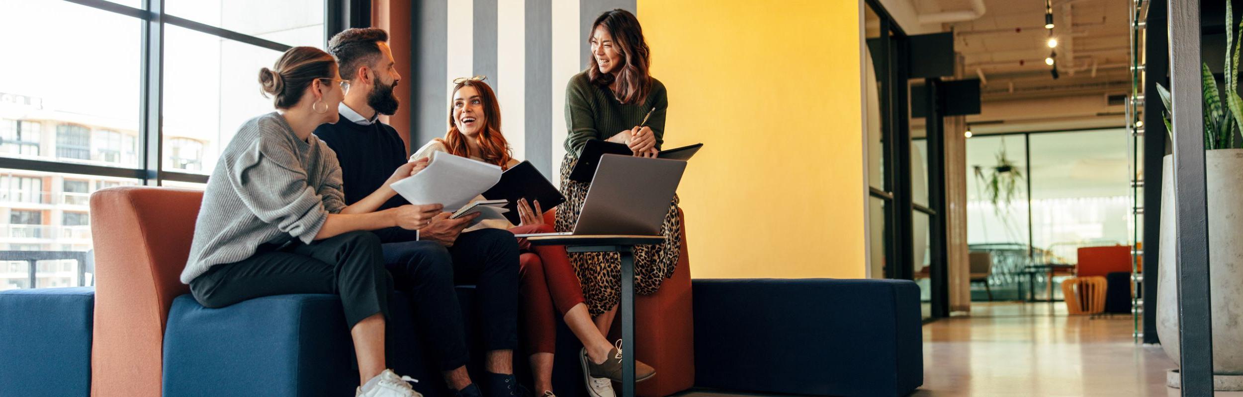 group of students sitting together working on class assignments